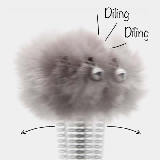 Jouet balle en pompon au bout d'un ressort pour le chat